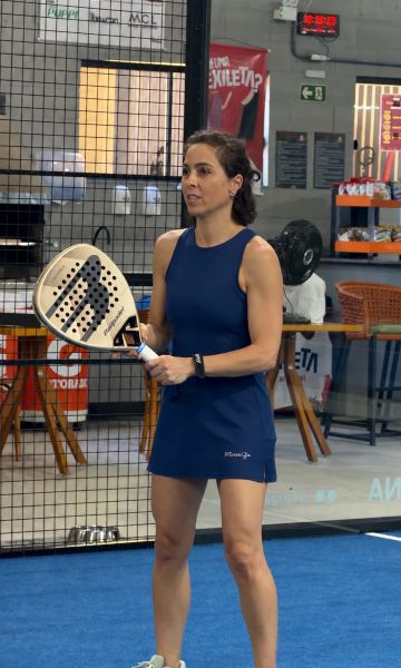 Padel player holding a padel racket on court
