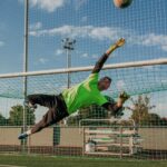 Goalkeeper diving to save the ball