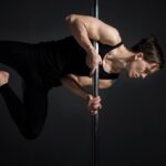 Pole athlete holding a figure on the pole