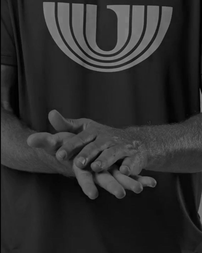 Massaging ULTRAGRIP Post-Workout cream into the hands